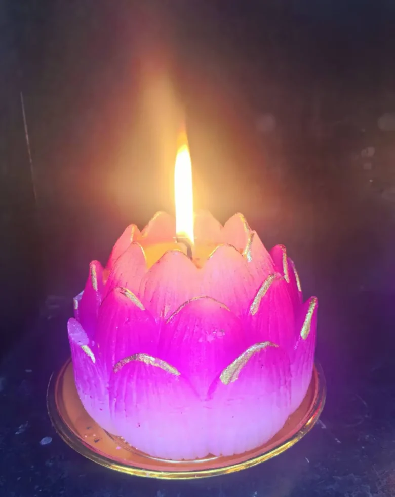 Lotus candle symbolizing balance and wellness
